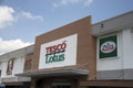 The sign name on the board of daylight at Tesco Lotus Discount Store on blue sky background.