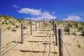 Pathway access to french sea dunes coast at sunny atlantic beach Royalty Free Stock Photo