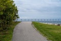 A pathway in an area for leisure activities. The Oresund Bridge, Malmo, Sweden in the background