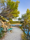 Pathway, bench and sea at Makarska, Croatia Royalty Free Stock Photo