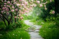 Pathway with blooming pink flowers under trees Royalty Free Stock Photo