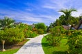 Pathway and bungalows in tropical park Royalty Free Stock Photo