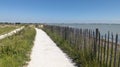 Pathway coastal path access of sand beach in La Rochelle ocean atlantic coast in France Royalty Free Stock Photo