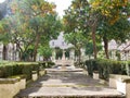 Pathway through a formal garden with fountain in Naples