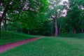 A pathway in the green woods in a summer sunny day at mountain, Mount Royal, Montreal Royalty Free Stock Photo