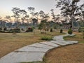 Pathway in the Indrokilo botanical garden, Boyolali, Indonesia. Stepping stones in the grass lawn, the way to success and mileston