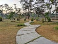 Pathway in the Indrokilo botanical garden, Boyolali, Indonesia. Stepping stones in the grass lawn, the way to success and mileston Royalty Free Stock Photo