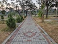 Pathway in the Indrokilo botanical garden, Boyolali, Indonesia. Stepping stones in the grass lawn, the way to success and mileston Royalty Free Stock Photo