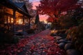 a pathway leading to a house with autumn leaves on the ground