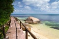 Pathway by the ocean with big stones and green plants Royalty Free Stock Photo