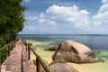 Pathway by the ocean with big stones and green plants Royalty Free Stock Photo