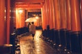Pathway orii gates with blur people at Fushimi Inari Shrine at night and rain Kyoto, Japan Royalty Free Stock Photo