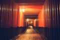 Pathway orii gates at Fushimi Inari Shrine at night and rain Kyoto, Japan Royalty Free Stock Photo