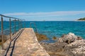 Pathway on the rocky beach in Istria Royalty Free Stock Photo