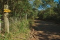 Pathway and sign with instructions to hikers