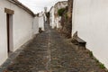 Pathway in the street with white houses in the village of Monsaraz, Portugal Royalty Free Stock Photo