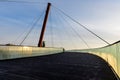 Pathway on the suspended bridge from Drumul Taberei Park, also known as Moghioros Park, in Bucharest, Romania, at sunrise in an