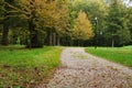 Pathway for walking and jogging in green beautiful public city park on autumn day Royalty Free Stock Photo