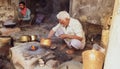 Patiala Punjab India 03 04 2021person on the roadside doing tin canning of the utensil on fire silver coating Kaali old tradition