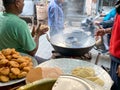 Patiala Punjab India 04 03 2021 A roadside street food vendor preparing fried food