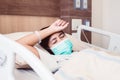 Patient asian woman having a headache or migraine severe in hospital,Dengue fever Royalty Free Stock Photo