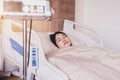 Patient Asian woman sleeping under blanket on sick bed at the hospital Royalty Free Stock Photo