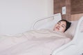 Patient Asian women sleeping under blanket on sick bed at the hospital Royalty Free Stock Photo