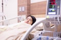 Patient Asian women sleeping under blanket on sick bed at the hospital Royalty Free Stock Photo