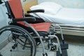 Patient bed and wheelchair in hospital nurse ward Royalty Free Stock Photo