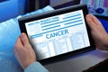 Patient with a cancer diagnosis in his digital medical report Royalty Free Stock Photo