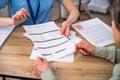 Patient checking medical records, reading and signing document at doctor office Royalty Free Stock Photo