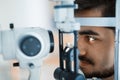 Patient or customer at slit lamp at optometrist or optician Royalty Free Stock Photo