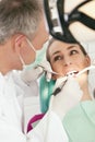 Patient with Dentist - dental treatment Royalty Free Stock Photo