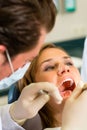 Patient with Dentist - dental treatment Royalty Free Stock Photo