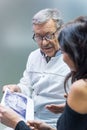 Patient and dentist holding xray.