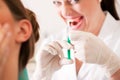 Patient at dentist receiving anesthetization Royalty Free Stock Photo