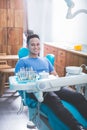 The patient dentist sitting in the dental chair