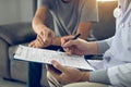 Patient is diagnosed with the effects of the disease and is pointing to the doctor report and discussing the effects Royalty Free Stock Photo