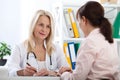 Patient in the doctor`s office, she is receiving a prescription medicine