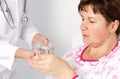 Patient drinks a glass of water Royalty Free Stock Photo