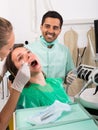 Patient is examined at dental clinic