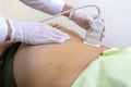 A patient gets an ultrasound scan in a hospital