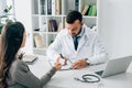 patient giving id card to general practitioner to fill insurance claim form