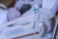 Patient hand drip receiving a saline solution and oxygenation on the bed in hospital Royalty Free Stock Photo