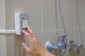 Patient hand pressing the emergency call button in the bathroom. Pressing nurse emergency call for helping Royalty Free Stock Photo