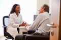 Patient Having Consultation With Female Doctor In Office Royalty Free Stock Photo