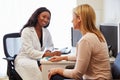 Patient Having Consultation With Female Doctor In Office Royalty Free Stock Photo