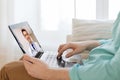 Patient having video call with doctor on laptop