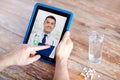 Patient having video chat with doctor on tablet pc Royalty Free Stock Photo