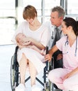 Patient with her newborn baby and doctors Royalty Free Stock Photo